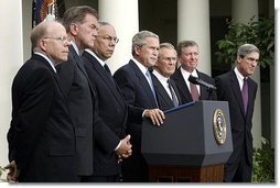 Standing with members of his national security team, President George W. Bush discusses America's intelligence reforms in the Rose Garden Monday, Aug. 2, 2004.   White House photo by Paul Morse