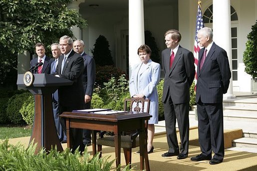 President George W. Bush delivers remarks during the signing ceremony of H.R. 4759, The United States-Australia Free Trade Agreement Implementation Act in the Rose Garden Tuesday, Aug. 3, 2004. "It expands our security and political alliance by creating a true economic partnership. It will create jobs and opportunities," said President Bush.