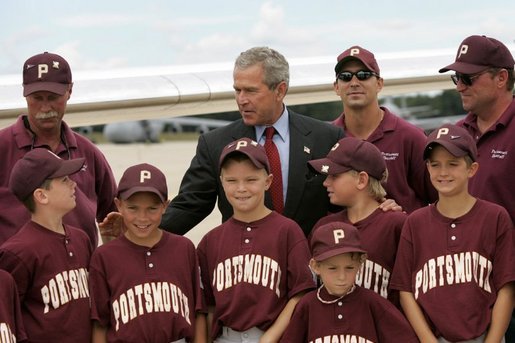 President George W. Bush greets members of the Portsmouth Little League baseball team after arriving at Pease Air National Guard base in Portsmouth, New Hampshire, Friday, Aug. 6, 2004. White House photo by Eric Draper.