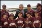 President George W. Bush greets members of the Portsmouth Little League baseball team after arriving at Pease Air National Guard base in Portsmouth, New Hampshire, Friday, Aug. 6, 2004. White House photo by Eric Draper.