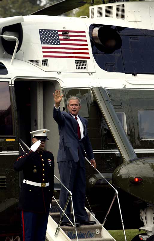 President George W. Bush waves from Marine One upon his departure to Pensacola, Fla., on the South Lawn Tuesday, August 10, 2004. White House photo by Joyce Naltchayan.