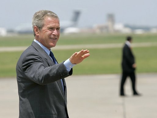 President George W. Bush waves as he walks across the tarmac to Air Force One before departing TSTC Airport in Waco, Texas, Wednesday, Aug. 11, 2004. White House photo by Eric Draper.