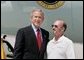 President George W. Bush meets Freedom Corps Greeter Mike Peschl in front of Air Force One in Las Vegas, Nevada, Thursday, Aug. 12, 2004. Peschl has been an active volunteer with Habitat for Humanity of Las Vegas since 1996. White House photo by Eric Draper
