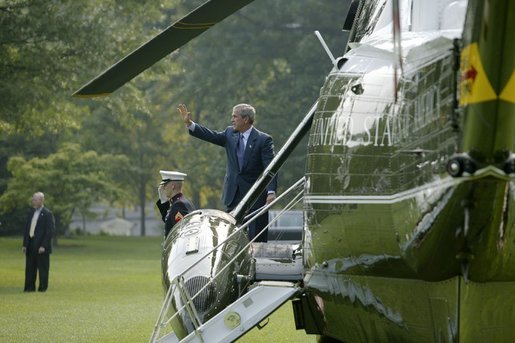 Before attending a meeting with administration officials, Sikh religious and community leaders watch as President George W. Bush departs the White House aboard Marine One Wednesday, Aug. 18, 2004.
