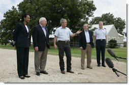 Standing with his national defense team, President George W. Bush talks with the press at Prairie Chapel Ranch in Crawford, Texas, Monday, Aug. 23, 2004. Pictured, from left, are: Dr. Condoleezza Rice, Vice President Dick Cheney, Secretary of Defense Donald Rumsfeld and Chairman of the Joint Chiefs of Staff General Richard Meyers.  White House photo by Paul Morse