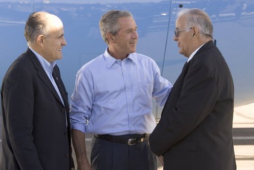 President George W. Bush and former New York City mayor Rudi Giuliani talk with Freedom Corps greeter Frank Ontiveros in Las Cruces, New Mexico on Thursday August 26, 2004. White House photo by Paul Morse.