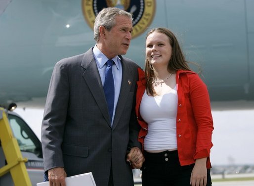 President George W. Bush talks with Freedom Corps Greeter Julie Dube, 17, in front of Air Force One after his arrival in Manchester, N.H., Monday, Aug. 30, 2004. Dube volunteers as a peer leader with the Boys and Girls Club of Greater Nashua, N.H. White House photo by Eric Draper.