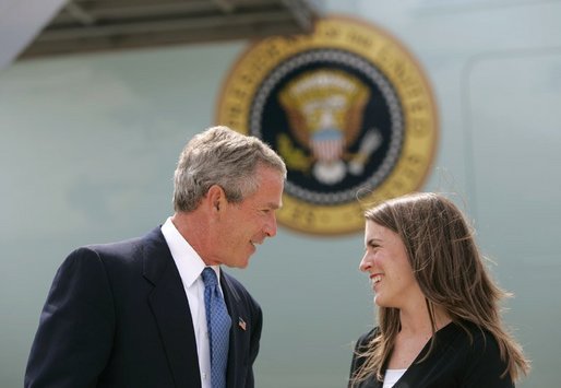 President George W. Bush talks with Freedom Corps Greeter Amy Bickel in front of Air Force One at Des Moines International Airport-Air National Guard Base, Tuesday, Aug. 31, 2004. Bickel co-founded the Central Iowa Young Women’s Leadership Institute to help high school girls develop strong leadership skills and a commitment to community service. White House photo by Eric Draper.