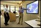 President George W. Bush receives briefing on Hurricane Frances from Max Mayfield, Director of the National Hurricane Center, in Miami, Fla., Wednesday, Sept. 8, 2004. White House photo by Eric Draper