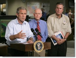 President George W. Bush delivers a live statement to Floridians affected by Hurricane Frances at the National Hurricane Center in Miami, Fla., Wednesday, Sept. 8, 2004. Also pictured from left are Max Mayfield Director of the National Hurricane Center and Florida Gov. Jeb Bush.   White House photo by Eric Draper