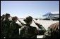 Military personnel from Nellis Air Force Base salute President George W. Bush as he boards Air Force One before departing Las Vegas, Nev., Tuesday, Sept. 14, 2004.  White House photo by Eric Draper