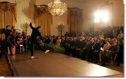 President George W. Bush and Laura Bush watch the performance of Joaquin Cortes as he dances to a quintet of Flamenco musicians during a Hispanic Heritage Month celebration in the East Room of the White House Wednesday, Sept. 15, 2004.  White House photo by Joyce Naltchayan