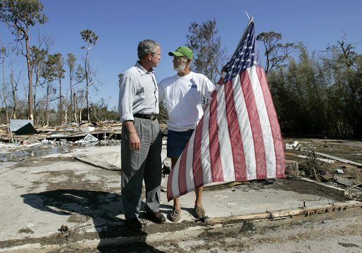 President George W. Bush talks with resident Jim Heinold during a walking tour of neighborhoods damaged by Hurricane Ivan in Pensacola, Florida, Sunday, Sept. 19, 2004 White House photo by Eric Draper