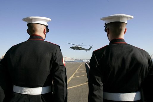 A Marine helicopter carries White House Staff to a New York City landing zone ahead of President George W. Bush, Monday, Sept. 20, 2004. White House photo by Eric Draper