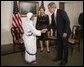 President George W. Bush and Mrs. Bush greet Sister Nirmala, Superior General of the Missionaries of Charity, in New York City Tuesday, Sept. 21, 2004. The mission was founded in 1950 by Mother Teresa in Calcutta, India. Sister Nirmala is Mother Teresa's successor. White House photo by Eric Draper.