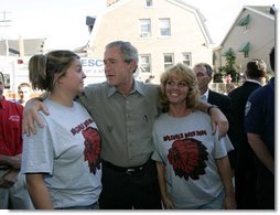 President George W. Bush talks with residents of Millvale, Pa. at the Millvale Fire Department during a visit to the area recently flooded by Tropical Depression Ivan in Allegheny County, Pa., Wednesday, Sept. 22, 2004.  White House photo by Eric Draper