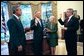President George W. Bush observes Chief of Staff Andy Card swearing-in Porter Goss as the new director of the CIA in the Oval Office Friday, Sept. 24, 2004. Also pictured is Director Goss's wife Mariel. White House photo by Eric Draper.