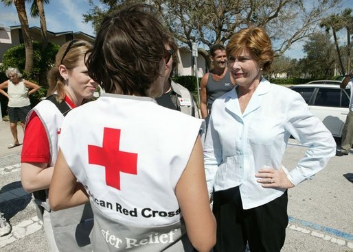 Laura Bush speaks with American Red Cross Disaster Relief workers outside of the Vero Beach Community Center where disaster relief family services are offered to local residents in Vero Beach, Fla., Friday, Oct. 1, 2004. Vero Beach, Fla., was one of the areas hardest hit by Hurricanes Jeanne and Frances. White House photo by Joyce Naltchayan.