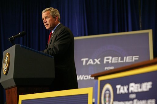 President George W. Bush speaks during the signing of H.R. 1308, the Working Families Tax Relief Act of 2004, at the South Suburban YMCA in Des Moines Iowa, Monday, Oct. 4, 2004. White House photo by Tina Hager