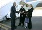 President George W. Bush meets USA Freedom Corps Greeters Blake and Mona Schomas and their daughter Katherine at the Wilkes-Barre/Scranton International Airport in Avoca, Pa., Wednesday, Oct. 6, 2004. Mr. and Mrs. Schomas founded "Home of Their Own," a sterile home environment where families can reside free of charge while their children recover from bone marrow transplant surgery.  White House photo by Eric Draper