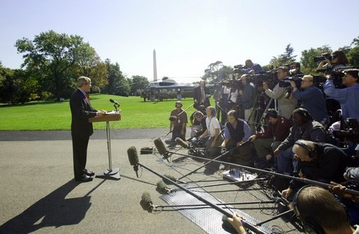 President George W. Bush discusses the Iraq report with the press on the South Lawn Thursday, Oct. 7, 2004. White House photo by Eric Draper
