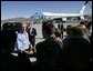President George W. Bush greets base personnel before departing aboard Air Force One at Reno/Tahoe International Airport-Nevada Air National Guard Base, Thursday, Oct. 14, 2004. White House photo by Eric Draper