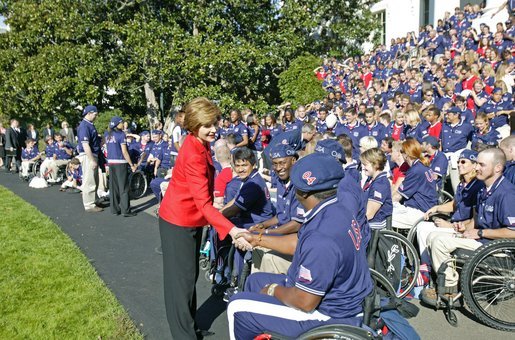 Laura Bush greets members of the 2004 U.S. Olympic and Paralympic Teams on the South Lawn Monday, Oct. 18, 2004. White House photo by Tina Hager