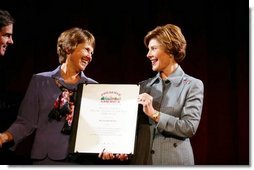 Laura Bush presents Kathleen "Kathy" Keen with a certificate honoring her as the national Preserve America History Teacher of the Year at the New York Historical Society in New York, Oct. 19, 2004.  White House photo by Joyce Naltchayan