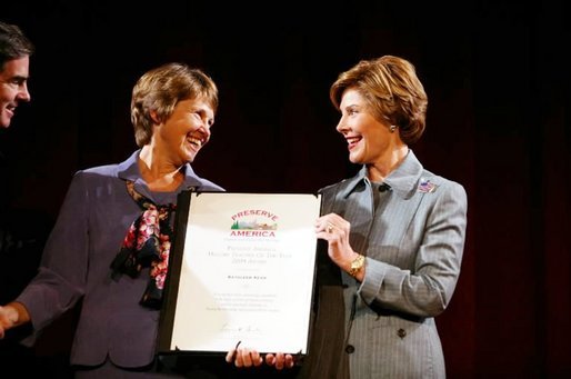 Laura Bush presents Kathleen "Kathy" Keen with a certificate honoring her as the national Preserve America History Teacher of the Year at the New York Historical Society in New York, Oct. 19, 2004. White House photo by Joyce Naltchayan