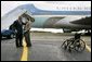 President George W. Bush talks with USA Freedom Corps Greeter Dan Yeric in front of Air Force One at Akron Canton Regional Airport in Canton, Ohio, Friday Oct. 22, 2004. Dan has been a volunteer at Akron Children's Hospital for the past 12 years and a patient at the hospital intermittently since he was diagnosed with spina bifida as an infant. White House photo by Eric Draper.