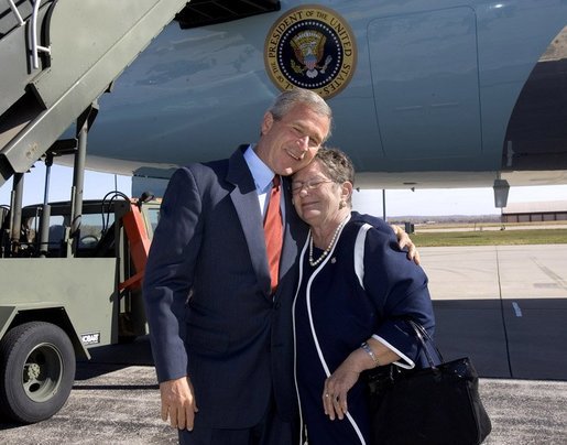 President George W. Bush meets USA Freedom Corps Greeter Donna Campbell at Offutt Air Force Base in Omaha, Nebraska, Monday, Oct. 25, 2004. For more than nine years, Donna has been a full-time volunteer at Messenger of Hope Ministries (MOHM) at the Christian Worship Center in Council Bluffs, Iowa. White House photo by Eric Draper.