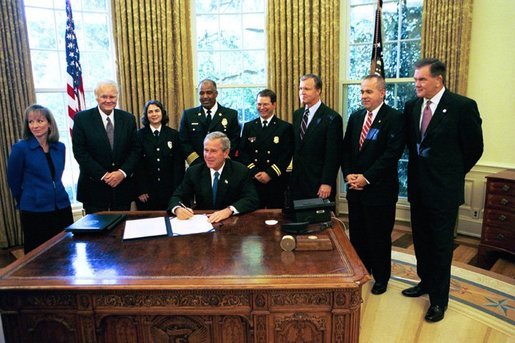 President George W. Bush signs HR 5467, The Department of Homeland Security Appropriations Act for the Fiscal Year 2005, in the Oval Office Monday, Oct. 18, 2004. White House photo by Tina Hager