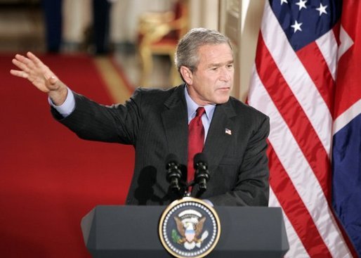 President George W. Bush answers a question during a press conference with British Prime Minister Tony Blair in the East Room of the White House on Friday November 12, 2004. White House photo by Paul Morse