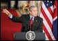 President George W. Bush answers a question during a press conference with British Prime Minister Tony Blair in the East Room of the White House on Friday November 12, 2004. White House photo by Paul Morse.