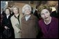 Laura Bush and former first ladies, from left, Rosalynn Carter, Sen. Hillary Clinton, and Barbara Bush attend the dedication ceremony for the William J. Clinton Presidential Center and Park in Little Rock, Ark., Nov. 18, 2004. White House photo by Eric Draper.