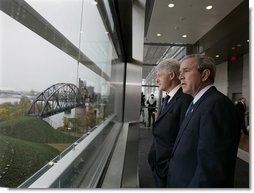 President George W. Bush and former President Bill Clinton tour the William J. Clinton Presidential Center and Park before participating in the dedication ceremony in Little Rock, Ark., Nov. 18, 2004.  White House photo by Eric Draper