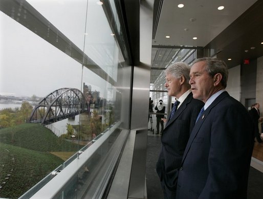 President George W. Bush and former President Bill Clinton tour the William J. Clinton Presidential Center and Park before participating in the dedication ceremony in Little Rock, Ark., Nov. 18, 2004. White House photo by Eric Draper.