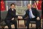 President George W. Bush and President Jintao Hu of China meet while attending an APEC summit in Santiago, Chile, Nov. 20, 2004. White House photo by Eric Draper