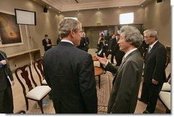 President George W. Bush participates in a morning meeting with Japanese Prime Minister Junichiro Koizumi while attending an APEC summit in Santiago, Chile, Nov. 20, 2004.  White House photo by Eric Draper