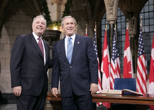 Before a bilateral session at Parliament Hill, President George W. Bush and Canadian Prime Minister Paul Martin meet in the rotunda in Ottawa, Canada, Nov. 30, 2004. White House photo by Paul Morse