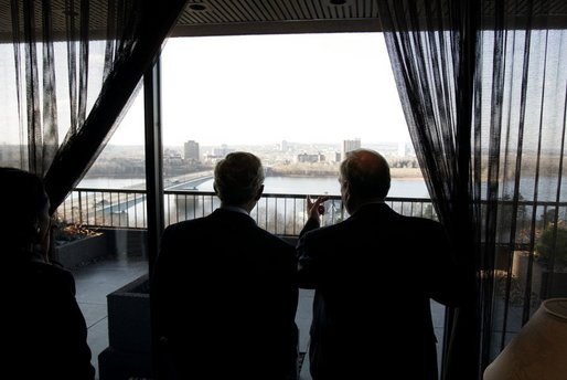 President George W. Bush looks at the cityscape with Canadian Prime Minister Paul Martin during a lunch meeting in Ottawa, Canada, Nov. 30, 2004. White House photo by Paul Morse