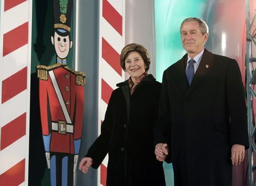 President George W. Bush and Laura Bush arrive at the Pageant of Peace to light the National Christmas Tree on the Ellipse near the White House Dec. 2, 2004. White House photo by Paul Morse.