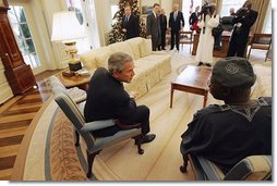 President George W. Bush talks with Nigerian President Olusegun Obasanjo in the Oval Office Thursday, Dec. 02, 2004.  White House photo by Tina Hager