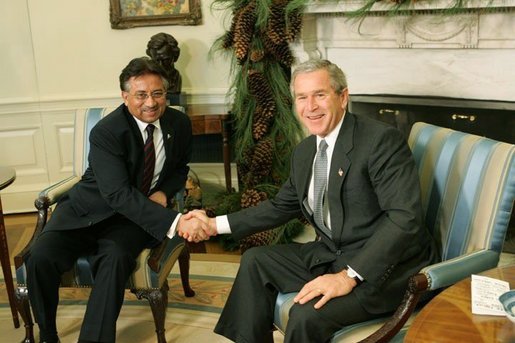 President George W. Bush and Pakistan President Pervez Musharraf pose during a photo-op in the Oval Office Saturday, Dec. 4, 2004.White House photo by Tina Hager