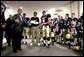 President George W. Bush addresses midshipmen in the Navy locker room before the 105th annual Army/Navy game in Philadelphia, Pa., Dec. 4, 2004. White House photo by Tina Hager