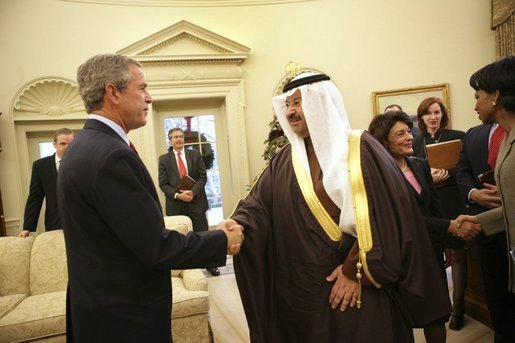 President George W. Bush shakes hands with interim Iraqi President Ghazi Al-Yawer at the end of their meeting in the Oval, Monday, Dec. 6, 2004. White House photo by Eric Draper