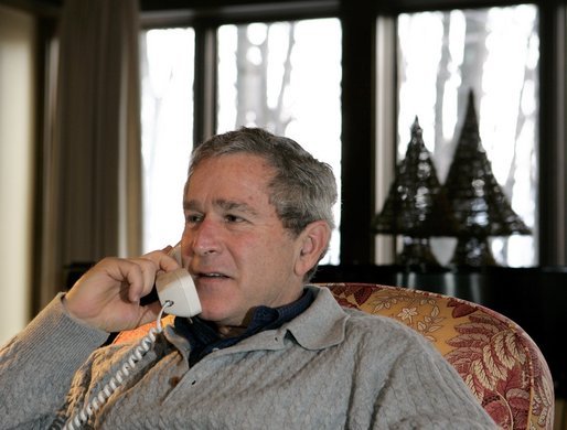 President George W. Bush participates in Christmas Eve Phone Calls to members of the armed forces at Camp David, Friday, Dec. 24, 2004. White House photo by Eric Draper.
