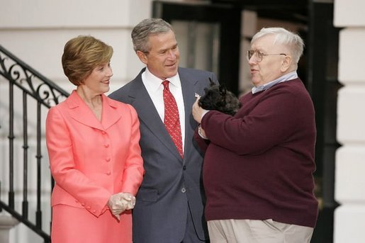 President George W. Bush and Laura Bush receive Miss Beazley, their new Scottish Terrier puppy, from breeder Bill Berry on the South Lawn of the White House Jan. 6, 2005. Miss Beazley is a birthday present from the President to Mrs. Bush. Beginning life at the White House in proper fashion, Miss Beazley's started her first day with a press conference. White House photo by Paul Morse.