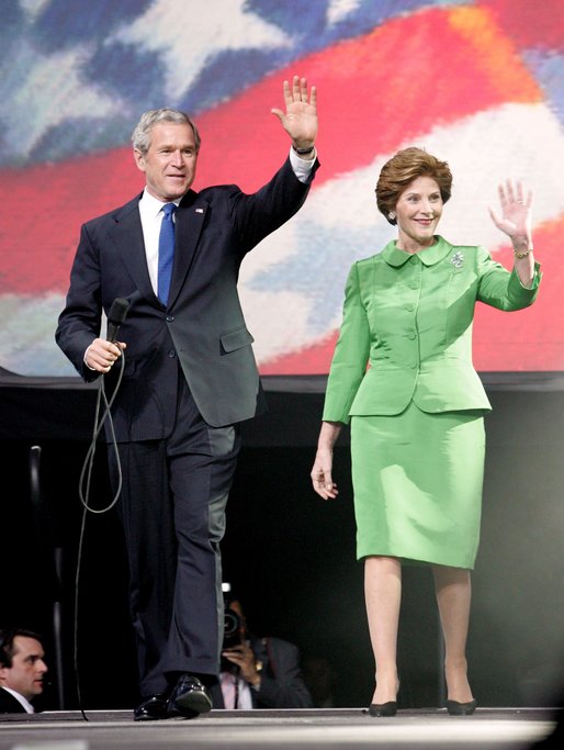 President George W. Bush and Laura Bush wave to young supporters during the pre-inaugural event 'America's Future Rocks Today- A Call to Service' youth event at the DC Armory in Washington, D.C., Tuesday, Jan. 18, 2005. The event highlighted the importance of volunteerism and community service in America's neighborhoods. White House photo by Susan Sterner