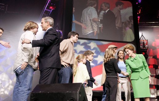 President George W. Bush and Laura Bush greet participants at the 'America's Future Rocks Today- A Call to Service' youth event at the DC Armory in Washington, D.C., Tuesday Jan. 18, 2005. White House photo by Susan Sterner